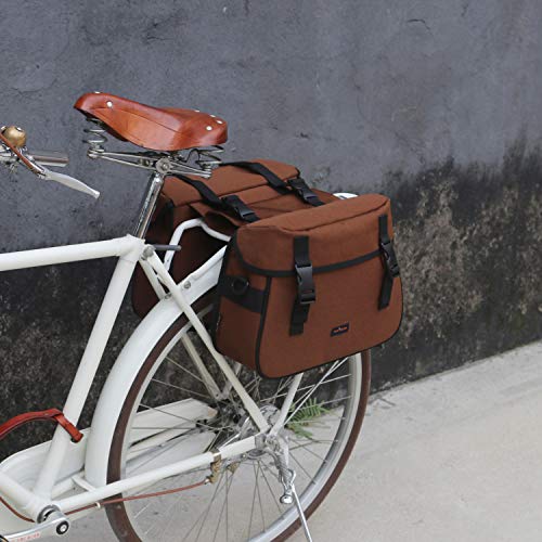 Bolsas de bicicleta gemelas para ser llevadas al hombro en tela de lona impermeable marrón.