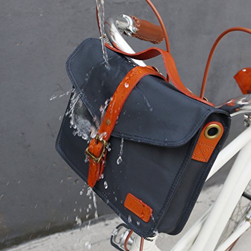 Pequeño bolso de cuero y lona impermeable y de cuero marrón marino que se puede fijar en la bicicleta.
