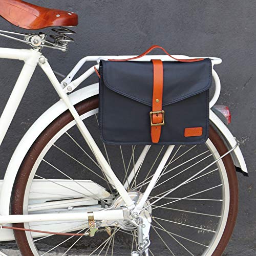 Pequeño bolso de cuero y lona, lona impermeable azul marino y marrón y cuero, para ser fijado en la bicicleta, el portaequipajes o el manillar.